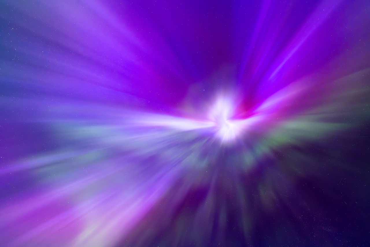 Purple aurora bands streaking above a dark horizon.